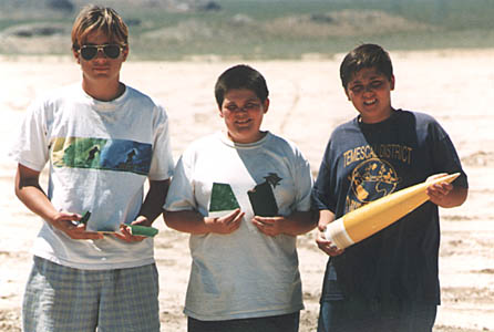 Boys holding Praying Mantis fragments